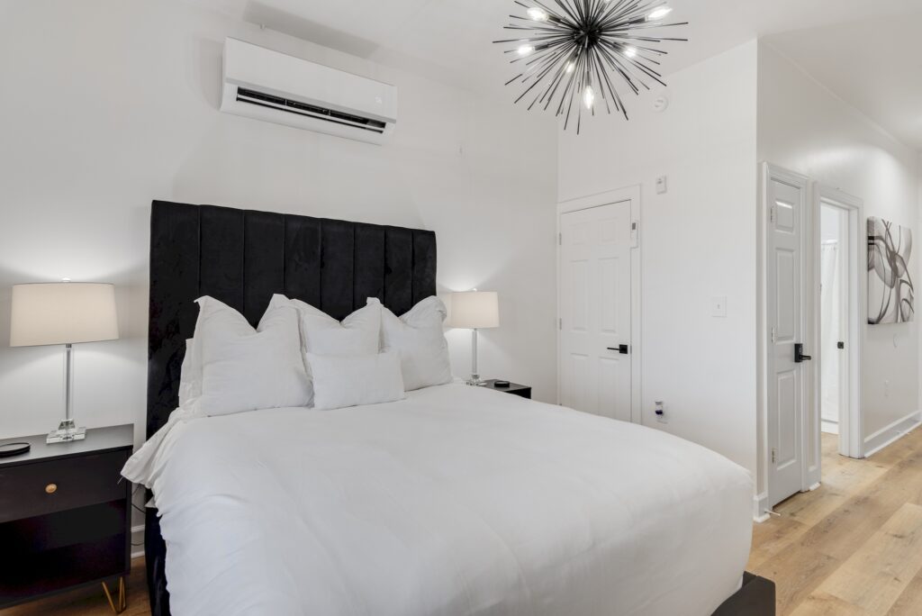 Sea Breeze studio interior with queen bed and sitting area
